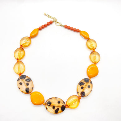 Collar naranja combinado - Fahoma.uy